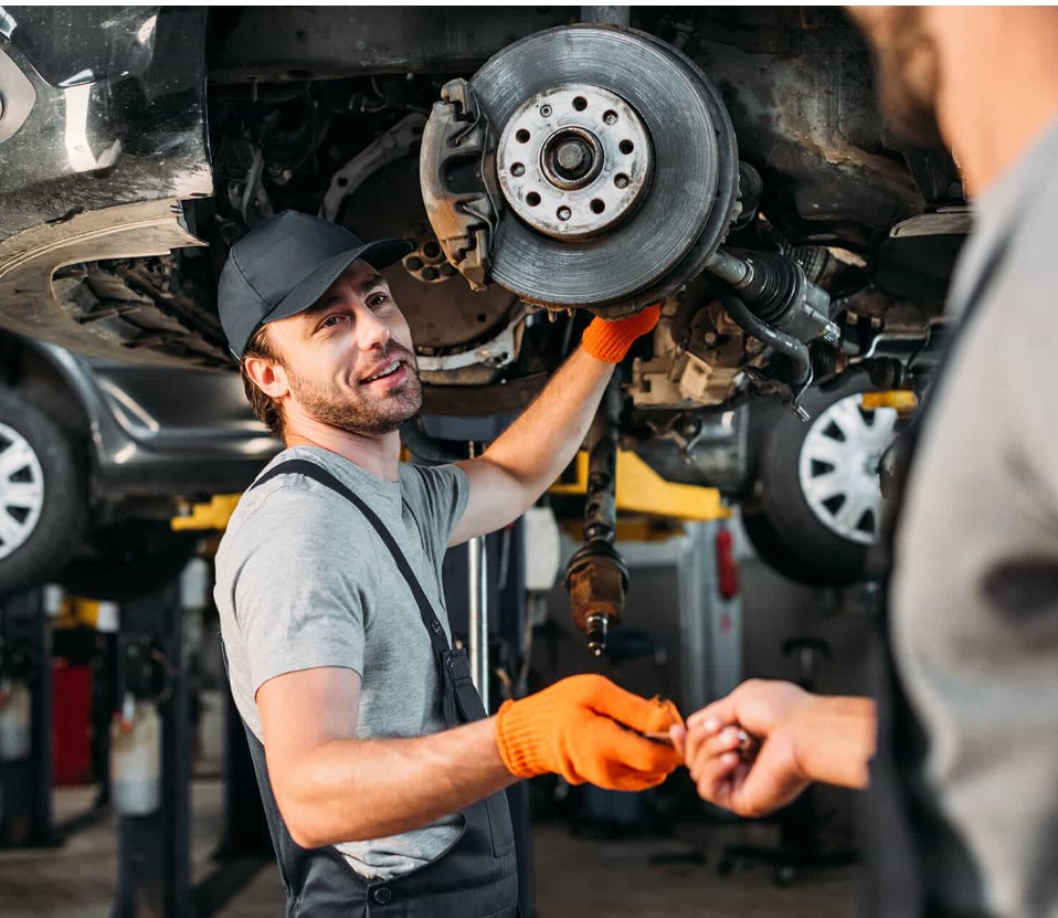 Friendly mechanic discussing car repairs with a customer